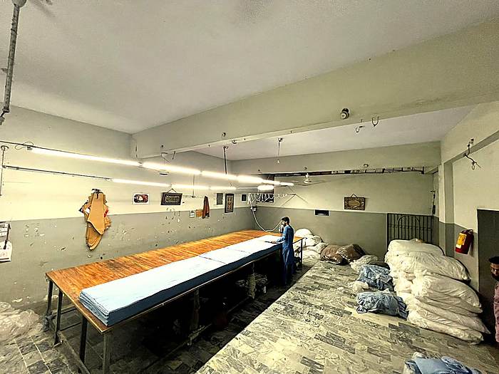 Fabric cutting table inside the Fine Apparels factory
